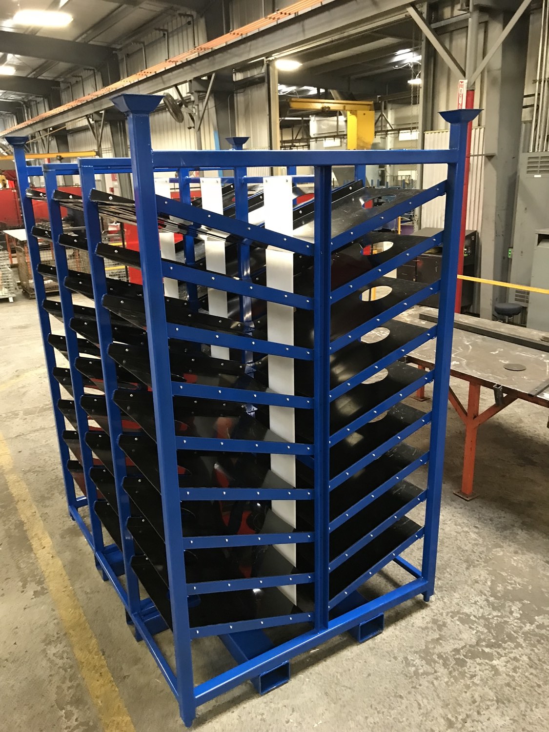 Multi-shelf gravity flow rack for kanban line-side delivery, built by Southern Perfection Fabrication