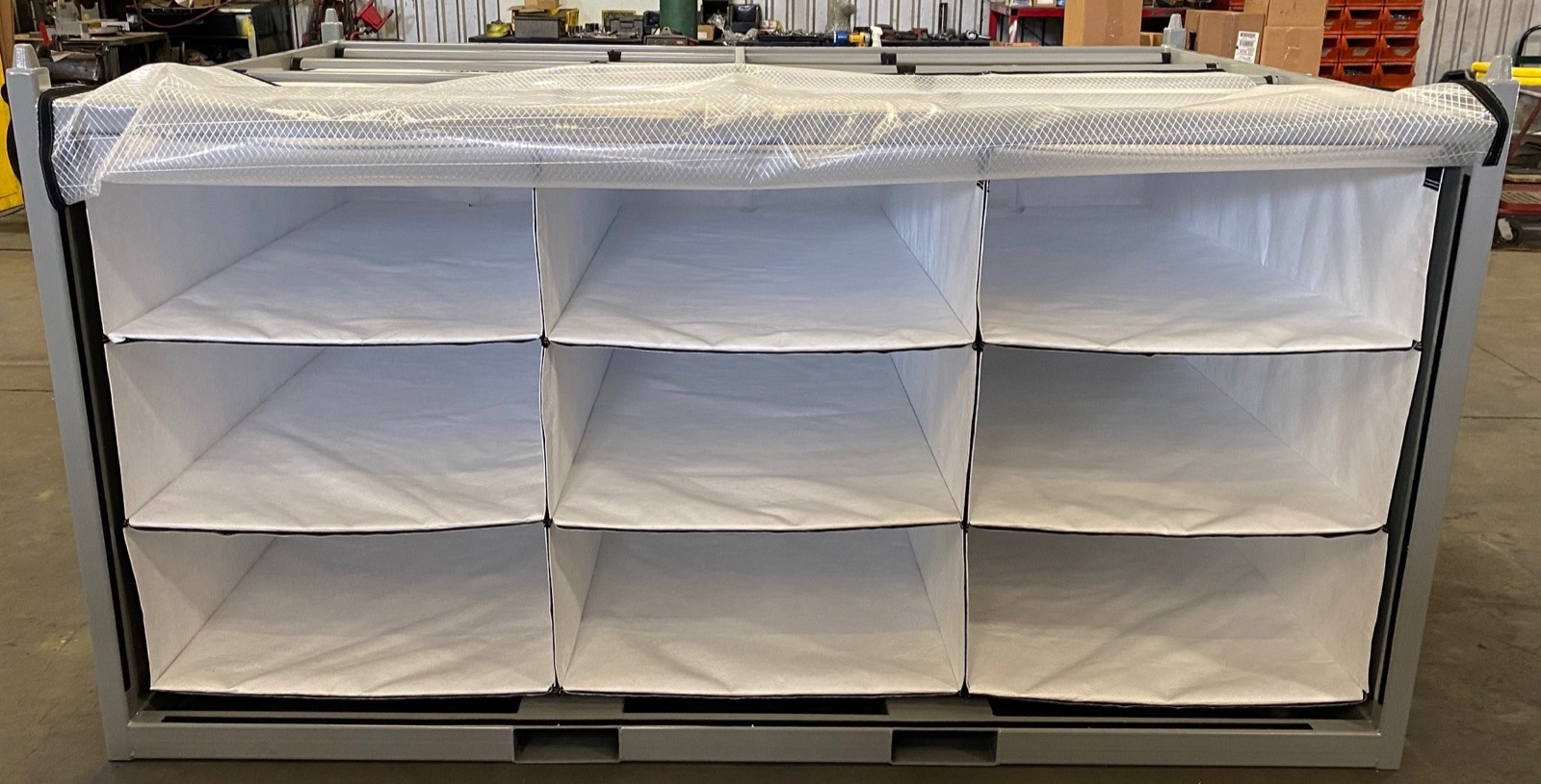 Custom returnable steel container with fabric bin dividers
