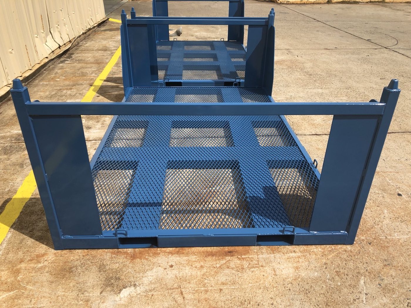 Custom steel pallet with expanded-metal deck and fork pockets, built by Southern Perfection Fabrication
